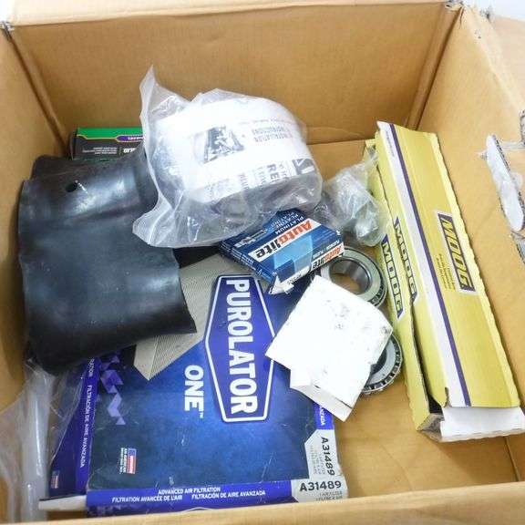 Assortment Of Automotive Items Includes Air Filter, Tire Liner, Control Arm, Spark Plug