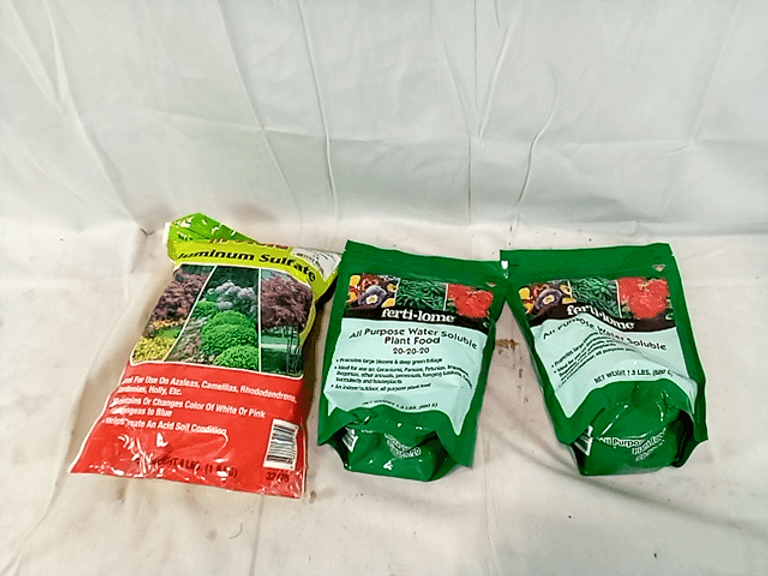 Assortment of 3 Fertilome Plant Food and HiField Aluminum Sulfate