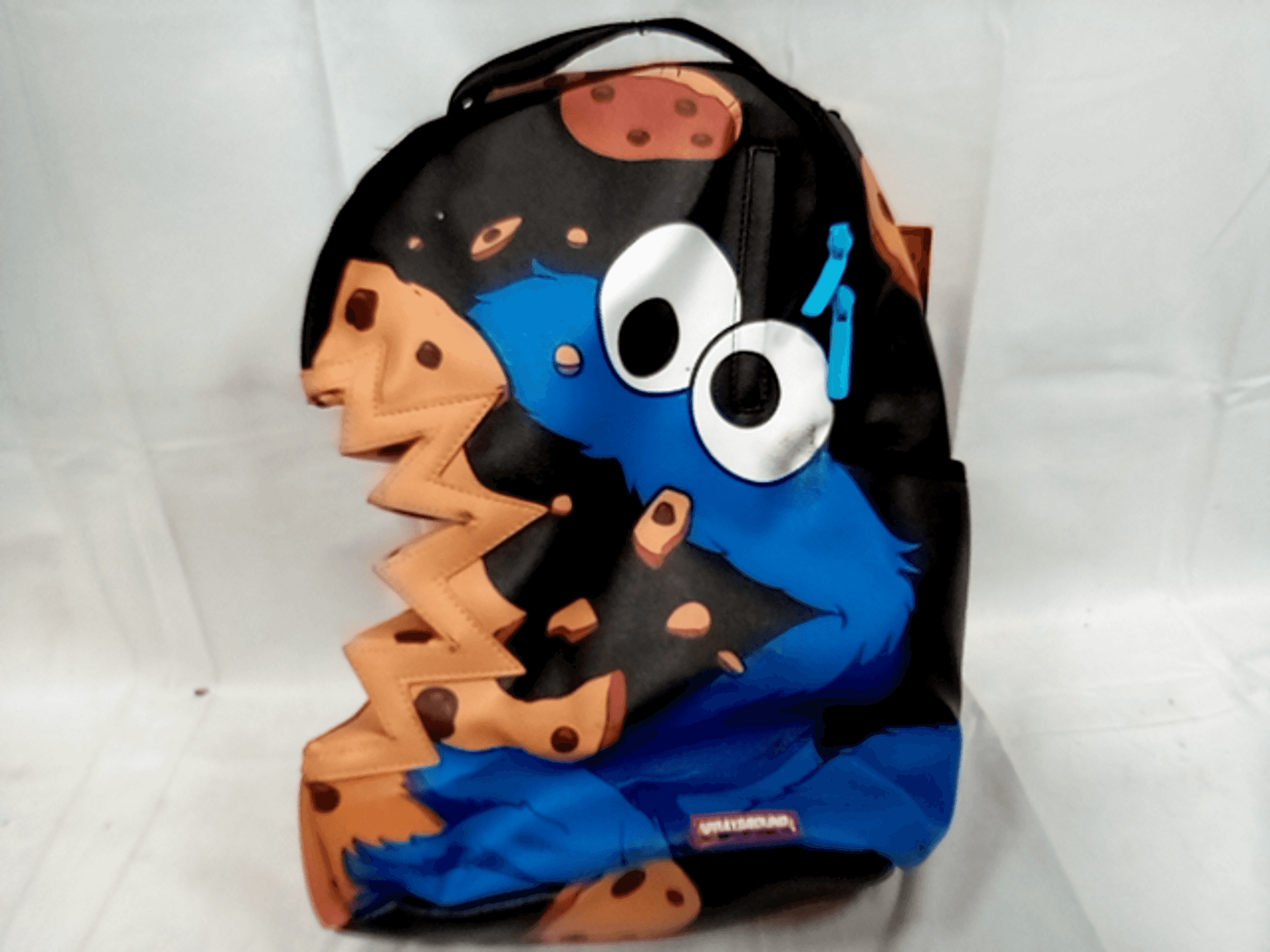 Sprayground x Sesame Street Cookie Monster Bite Bag Backpack